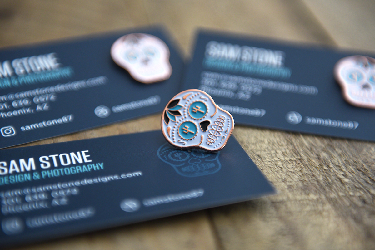 Business card and pin Sam Stone